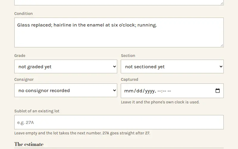 The lot form in a browser: condition note, grade, section, consignor and the estimate fields filled in for a pocket watch